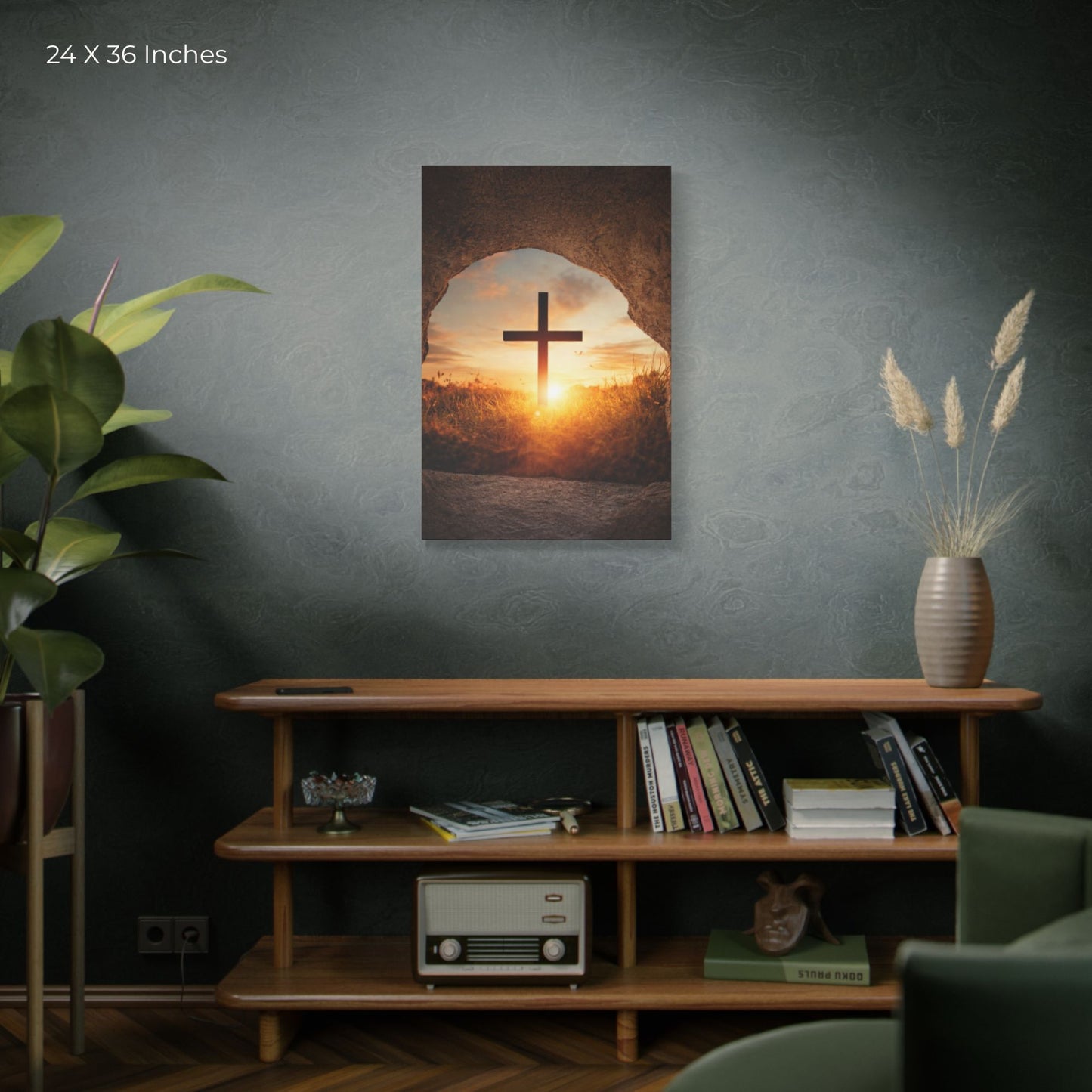 Room interior with a painting of a cross over a sunset, a shelf with books and decor, and a plant.