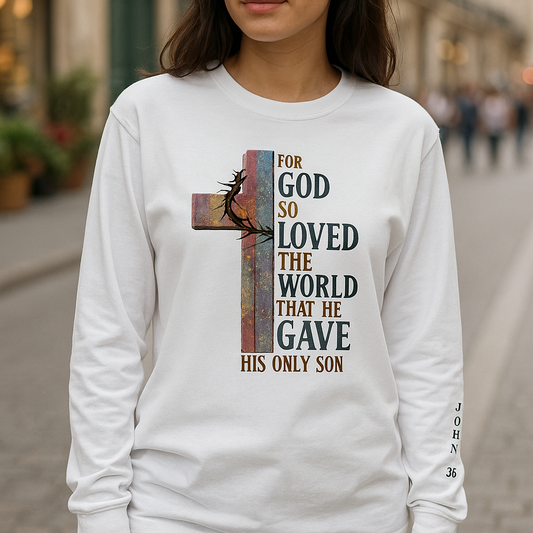 Woman wearing a white long-sleeve shirt with a religious design on a city street.