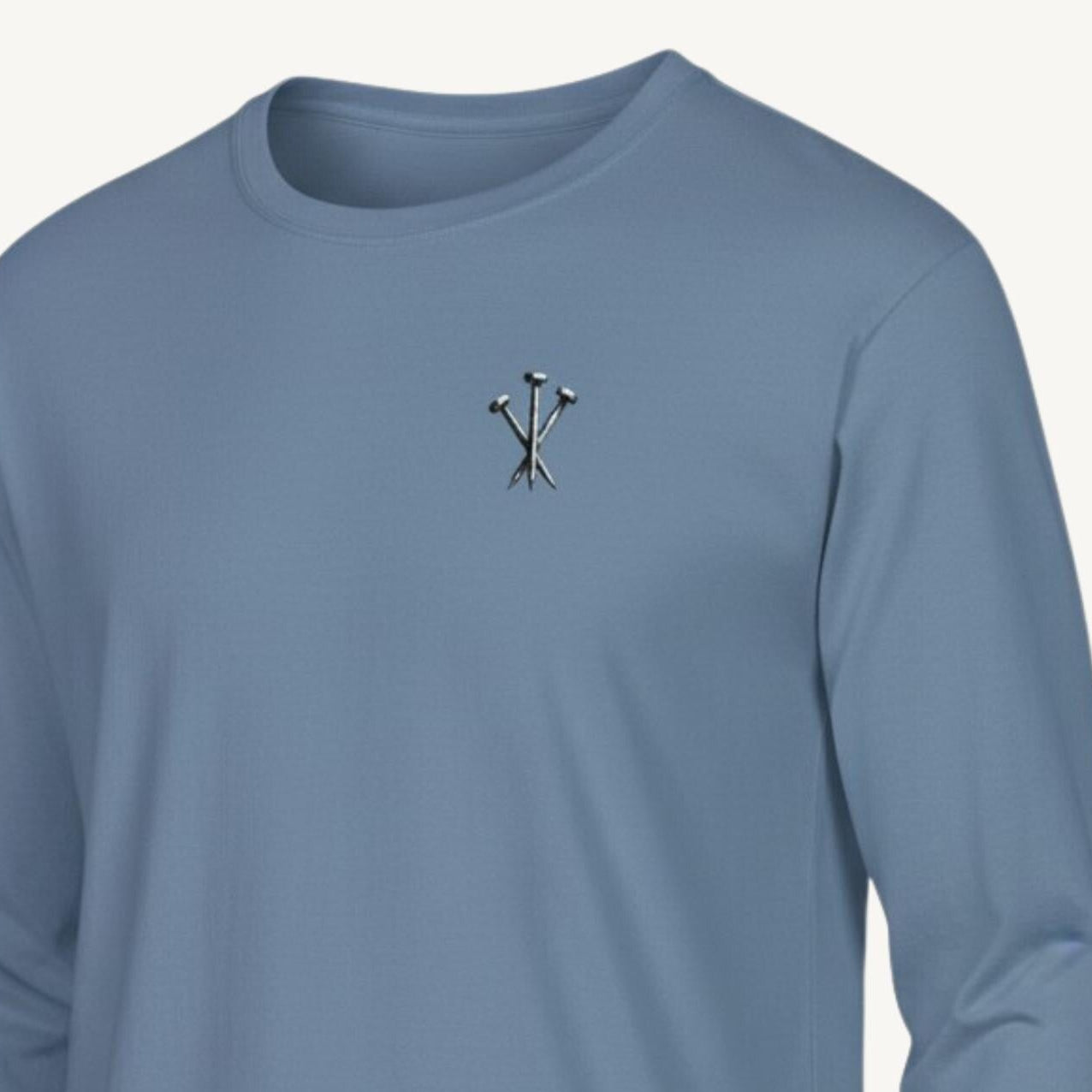 Blue long-sleeve shirt with a small logo on a white background