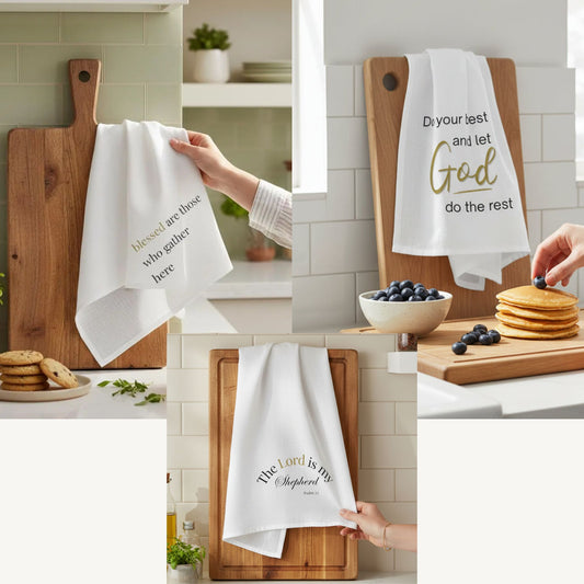 White towels with inspirational quotes on wooden cutting boards in a kitchen setting.