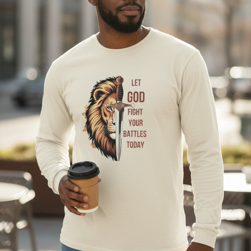 Man wearing a long-sleeve shirt with a lion graphic and text, holding a coffee cup outdoors.