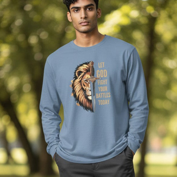 Man wearing a blue sweatshirt with a graphic design in a park
