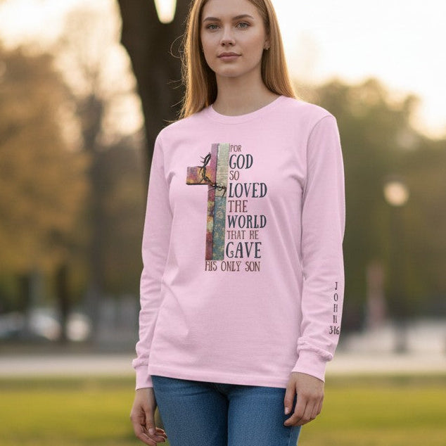 Woman wearing a pink sweatshirt with a graphic design outdoors